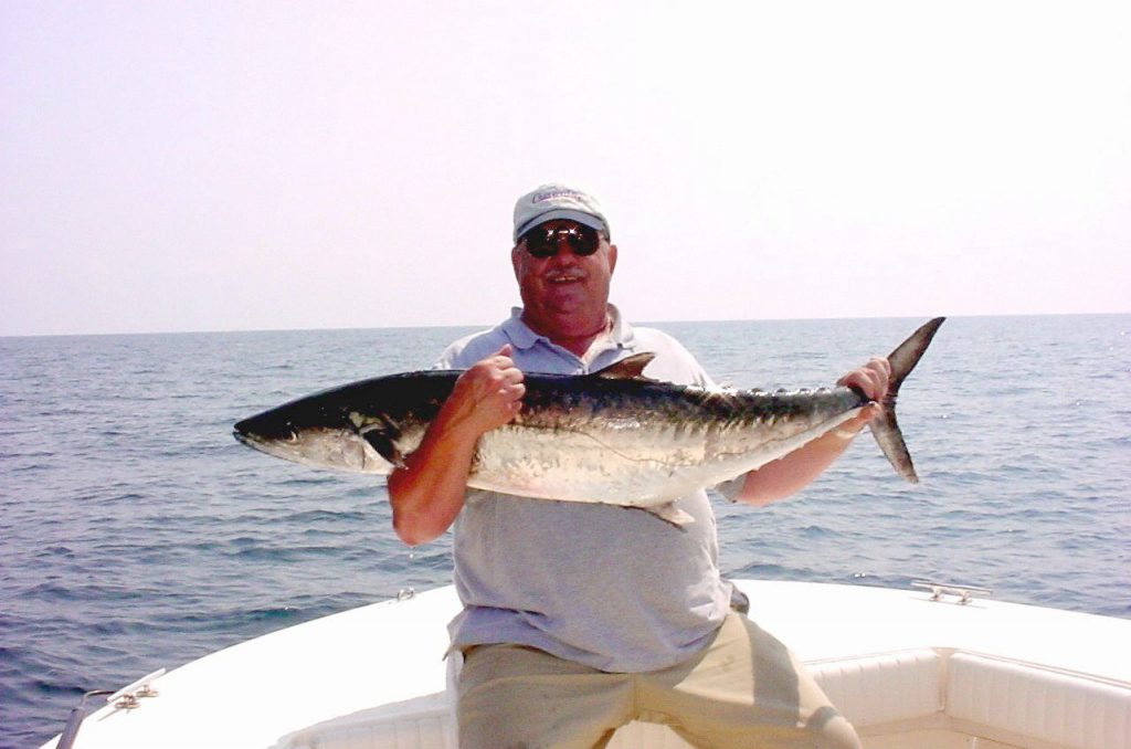 Bill Shular of Greensboro, with a 38 pound king caught at one of the N.C. artificial reefs. Photo by J. Dilsaver.